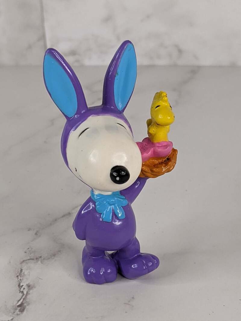 A vintage Snoopy and Woodstock Easter bunny figurine from the 1990's Peanuts collection.
