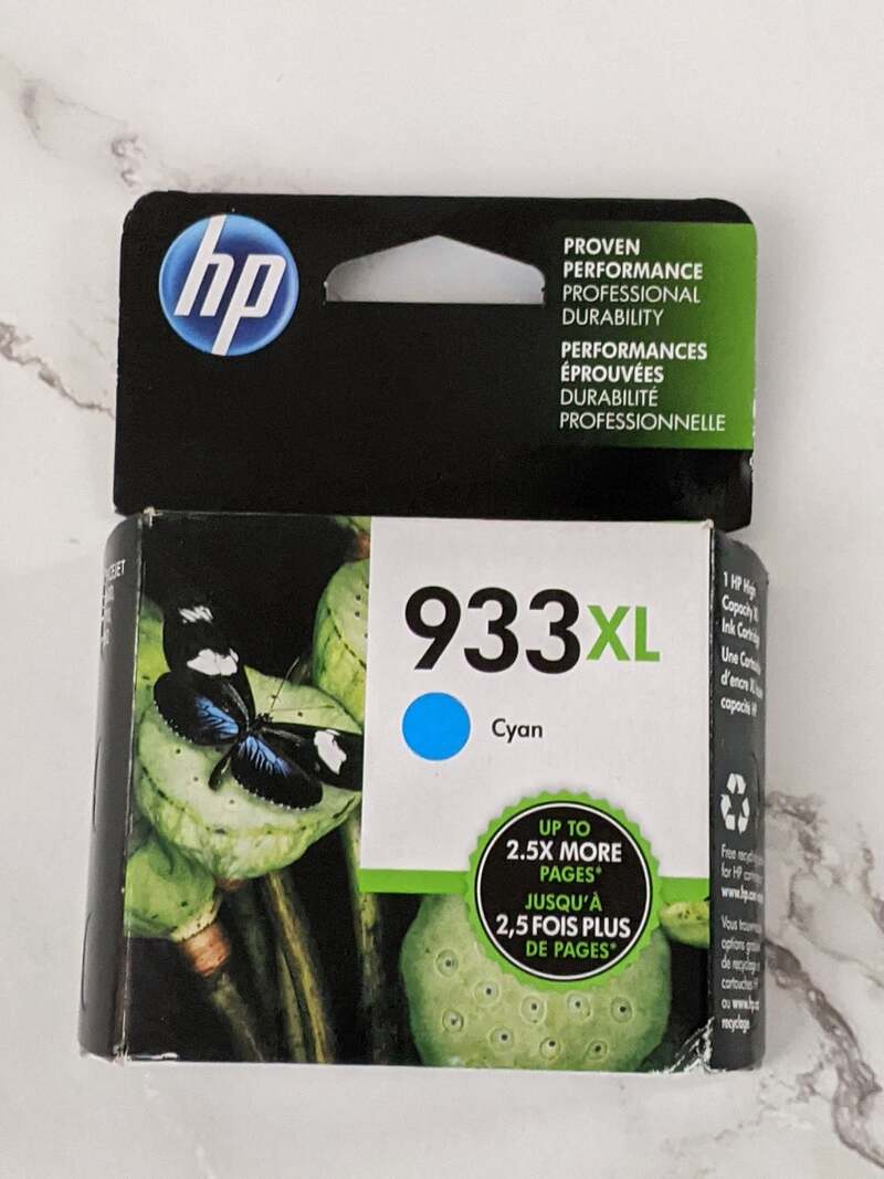 A package containing an HP branded ink cartridge of cyan ink, cartridge #933XL.